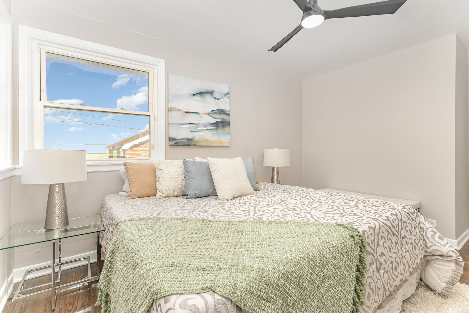 4852 West Hirsch Street Chicago, IL 60651 - Photo 20 of 38 a bedroom with a bed and a lamp