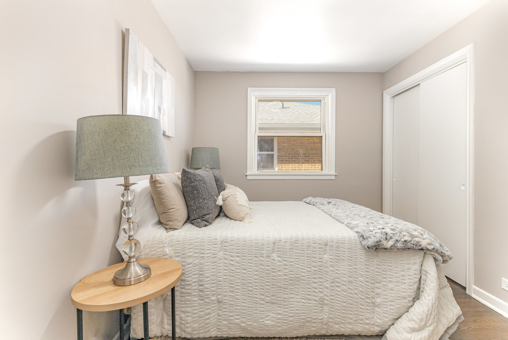 4852 West Hirsch Street Chicago, IL 60651 - Photo 21 of 38 a bedroom with a bed and a chair