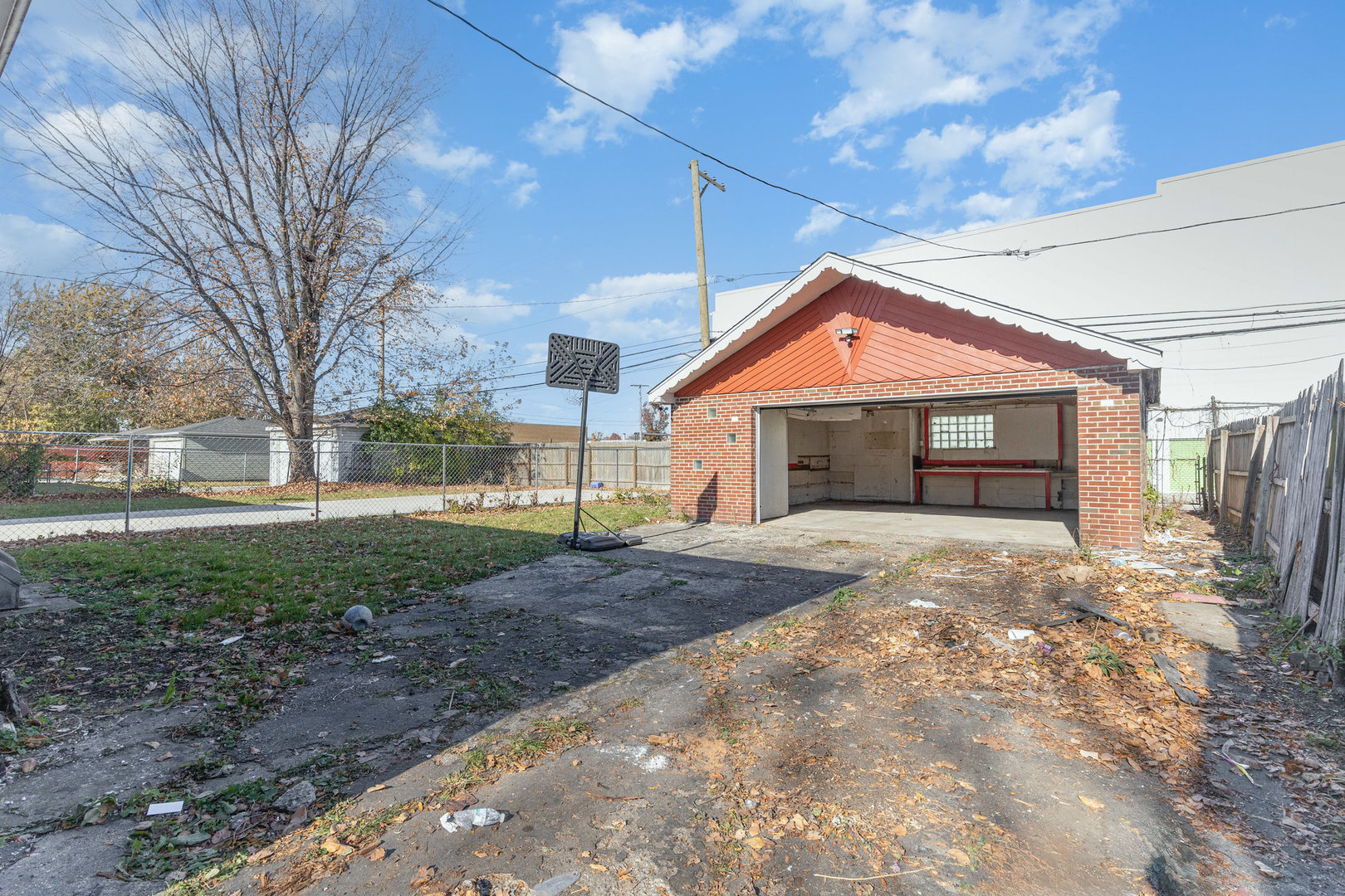 4852 West Hirsch Street Chicago, IL 60651 - Photo 31 of 38 a front view of a house with a yard and garage