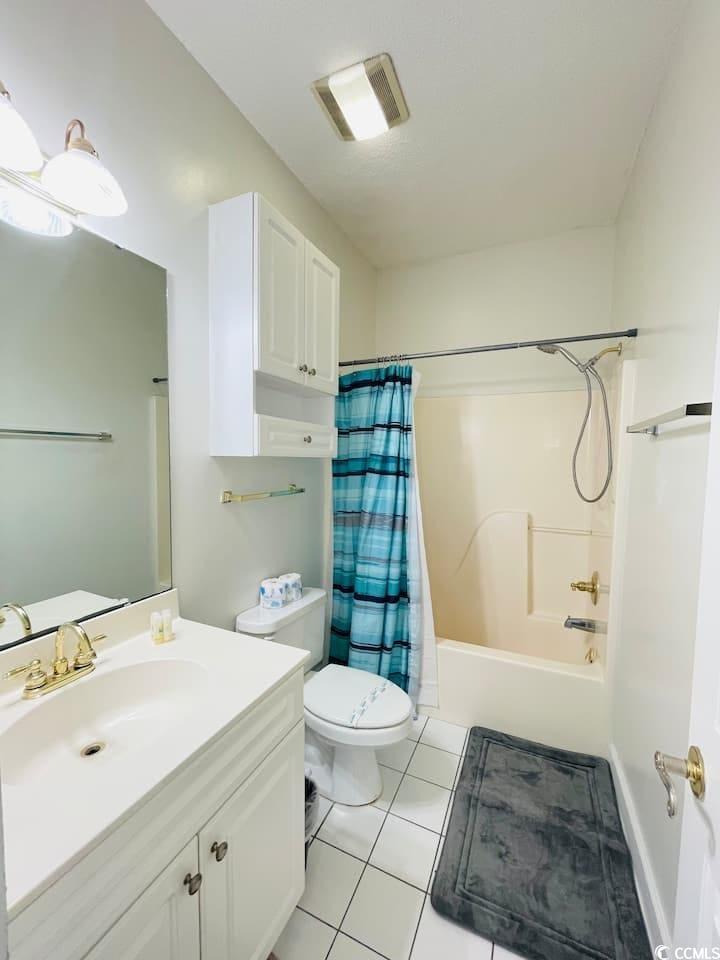 4631 Wild Iris Drive, Unit 301 Myrtle Beach, SC 29577 - Photo 27 of 37 Full bath with vanity, shower / tub combo, and light tile patterned floors