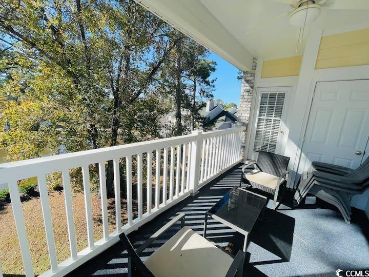 4631 Wild Iris Drive, Unit 301 Myrtle Beach, SC 29577 - Photo 28 of 37 Balcony featuring ceiling fan