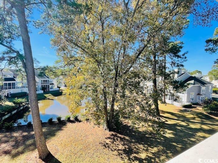 4631 Wild Iris Drive, Unit 301 Myrtle Beach, SC 29577 - Photo 33 of 37 View of yard featuring a water view