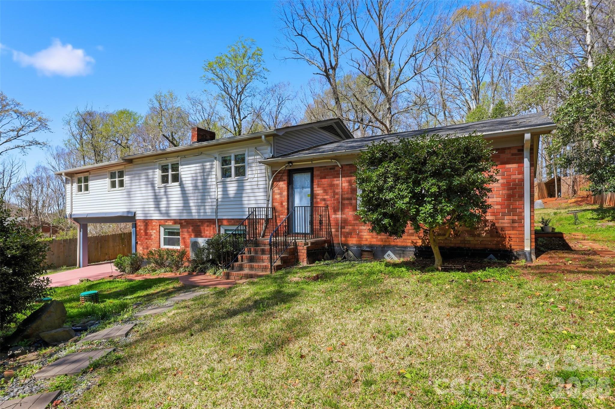 a view of a house with a yard porch and sitting area