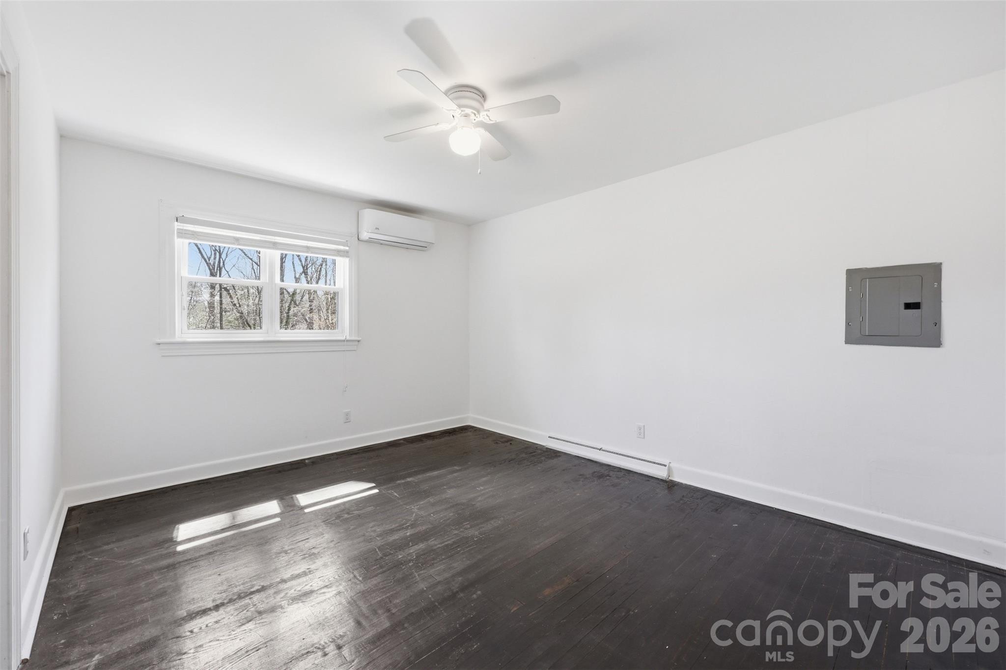 4920 Bright Road Charlotte, NC 28214 - Photo 12 of 46 an empty room with wooden floor and window