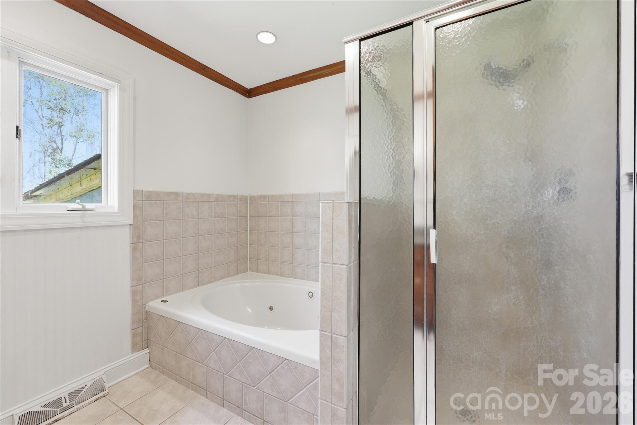 4920 Bright Road Charlotte, NC 28214 - Photo 14 of 46 a bathroom with a bathtub and shower