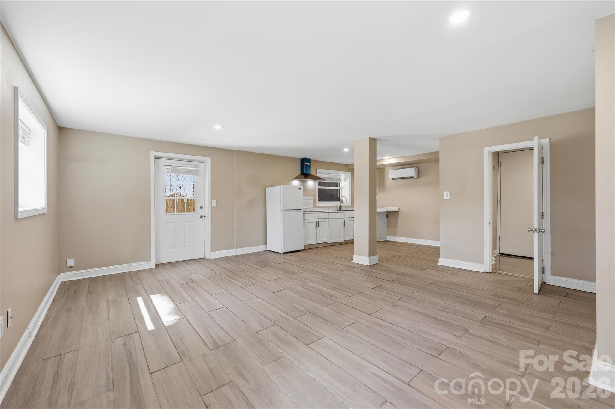 4920 Bright Road Charlotte, NC 28214 - Photo 18 of 46 wooden floor in an empty room with a window