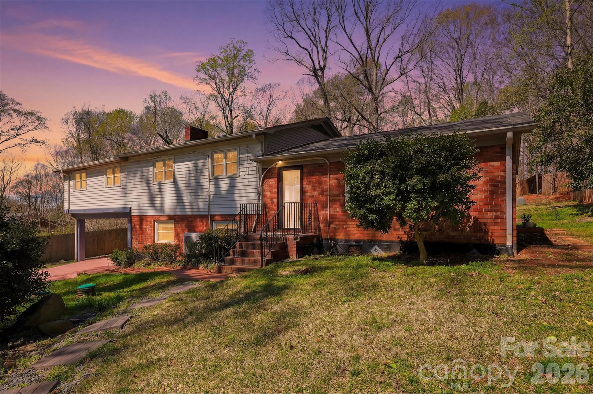 4920 Bright Road Charlotte, NC 28214 - Photo 2 of 46 a view of a house with a yard porch and sitting area