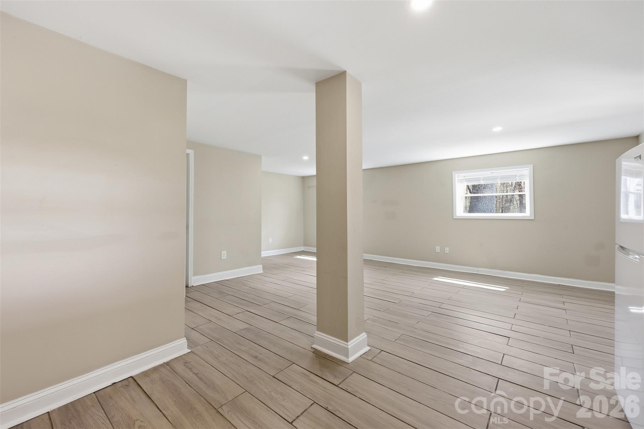 4920 Bright Road Charlotte, NC 28214 - Photo 23 of 46 wooden floor in an empty room with a window