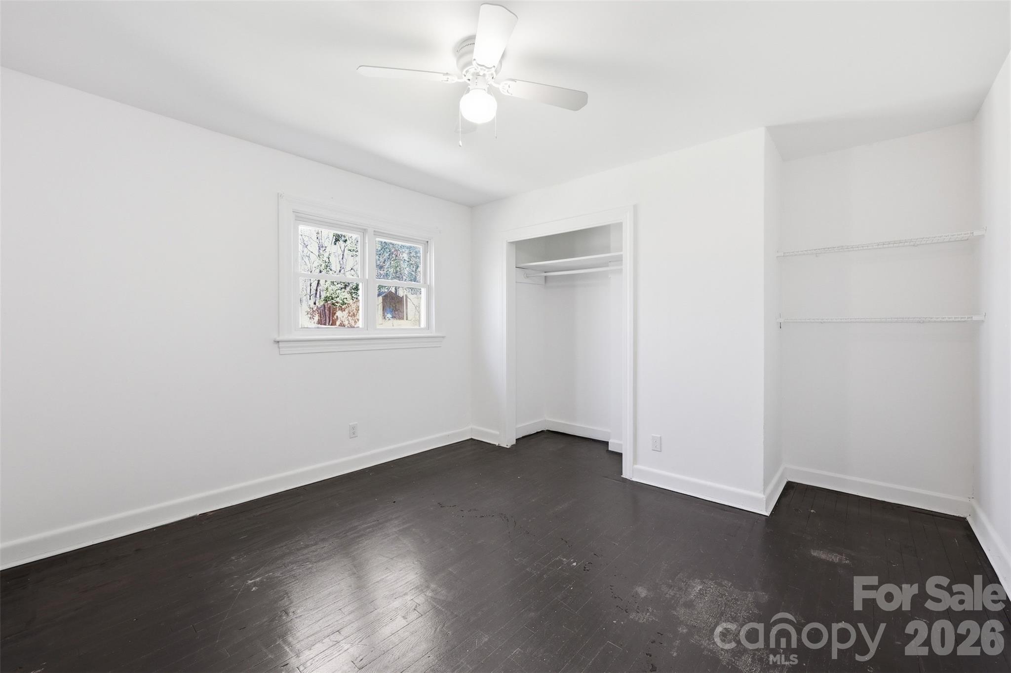4920 Bright Road Charlotte, NC 28214 - Photo 32 of 46 an empty room with wooden floor and windows