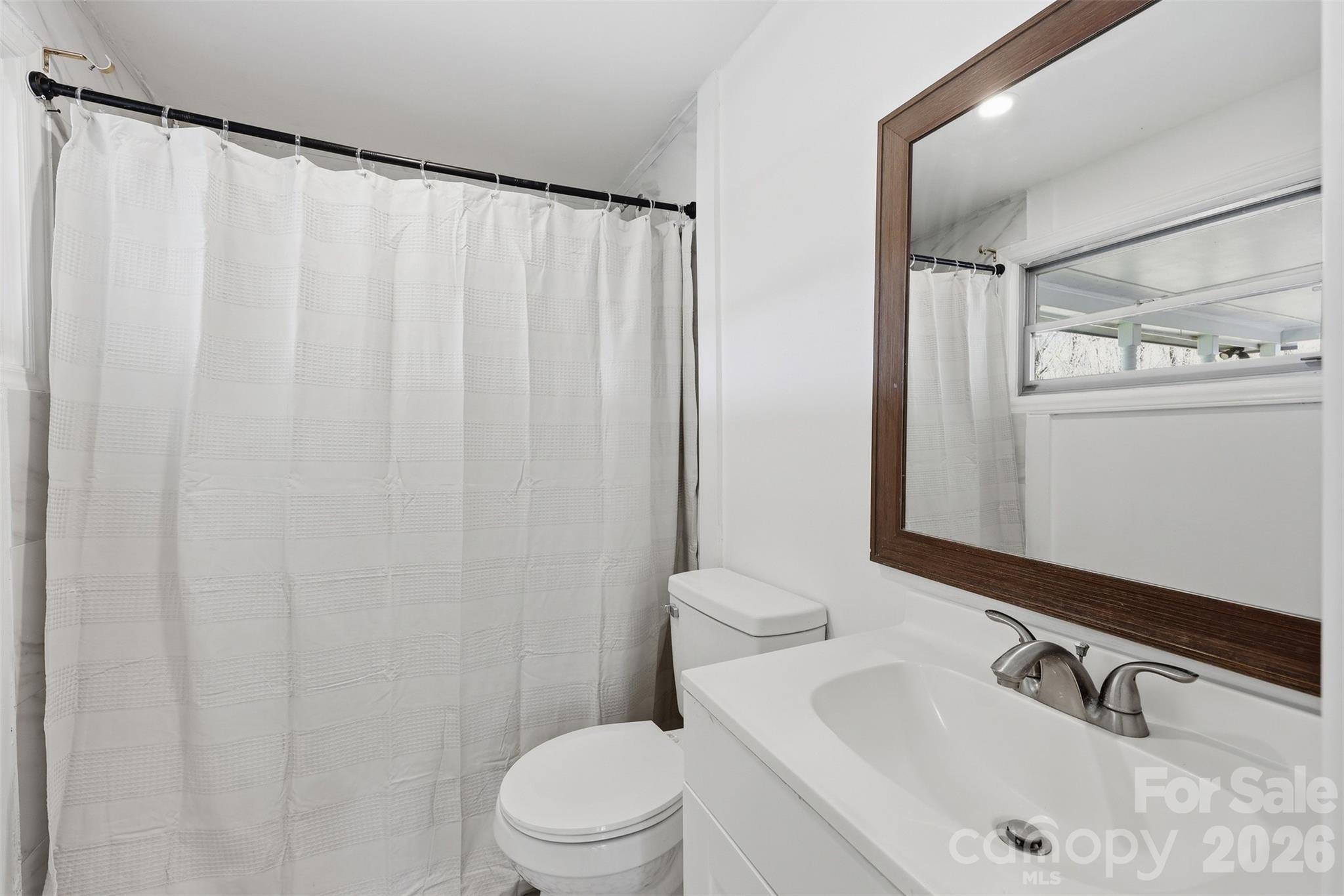 4920 Bright Road Charlotte, NC 28214 - Photo 33 of 46 a bathroom with a sink and a mirror