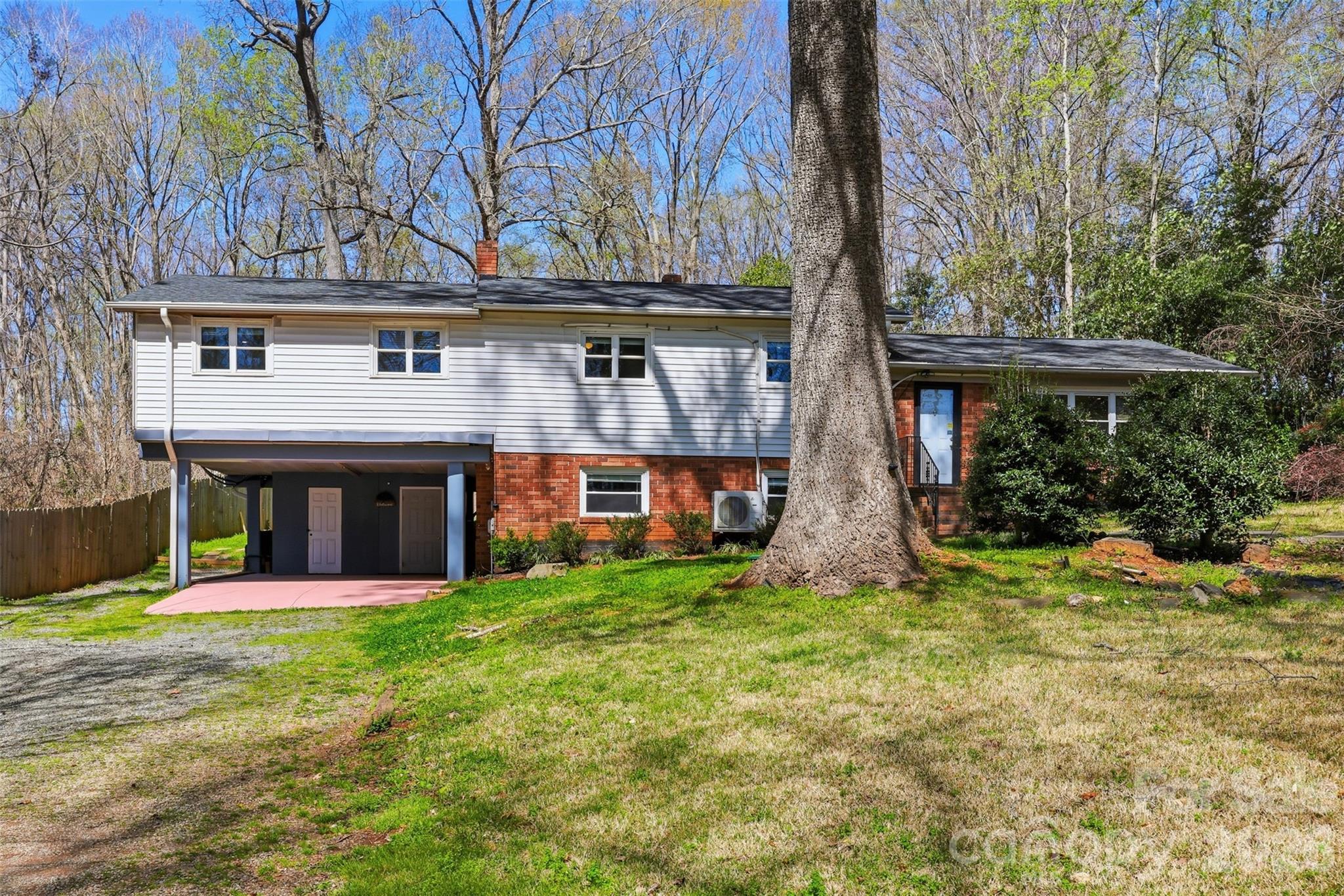 4920 Bright Road Charlotte, NC 28214 - Photo 36 of 46 a front view of a house with a yard