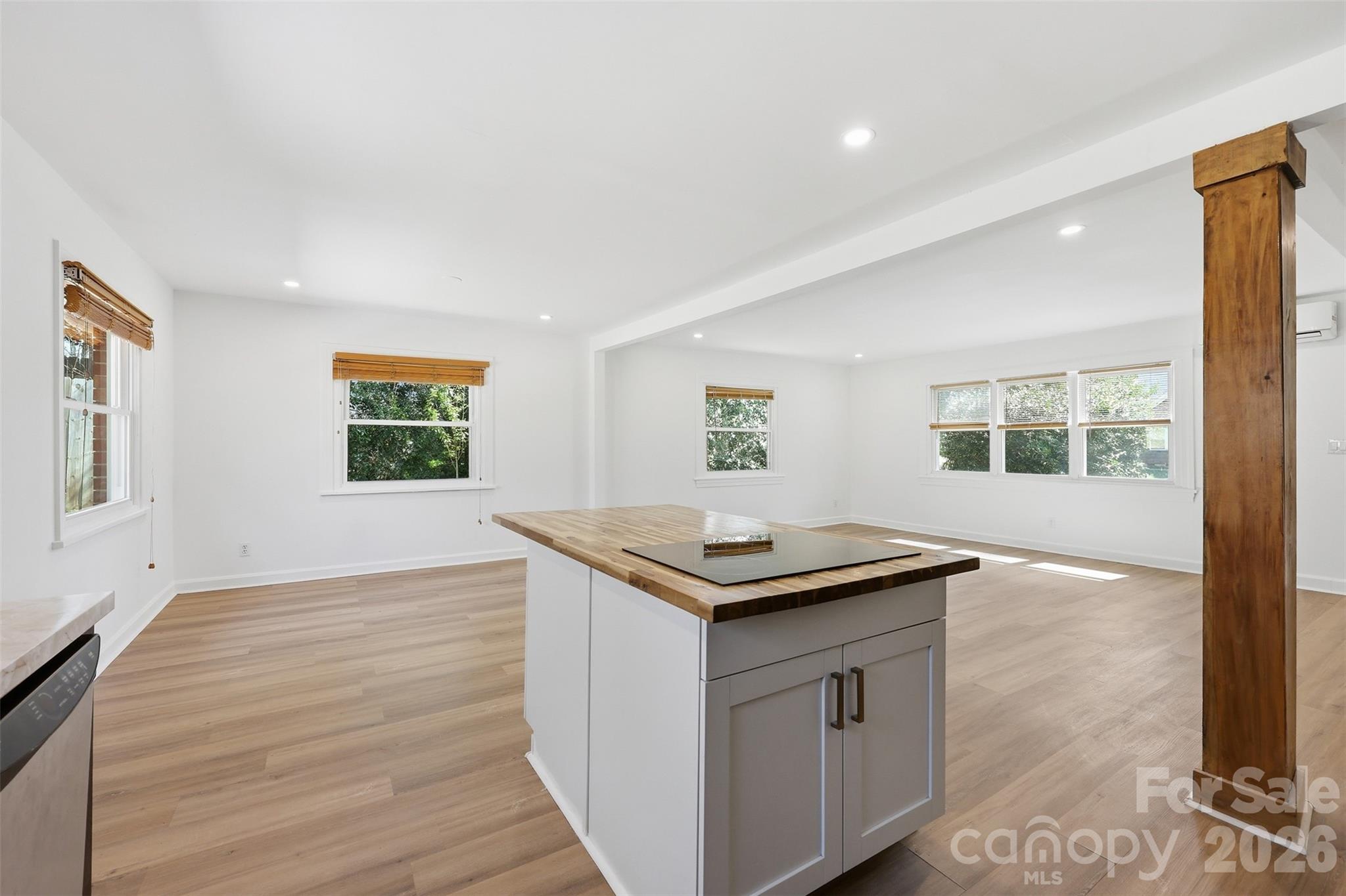 4920 Bright Road Charlotte, NC 28214 - Photo 8 of 46 a kitchen that has a sink and a wooden floor