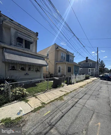a view of a house with couches in front of house