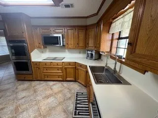 a bedroom with a bed and a refrigerator