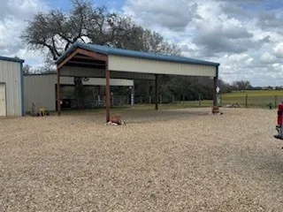 a kitchen with a sink a stove and a microwave