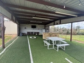 a view of outdoor space with deck and yard