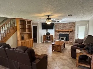 a large kitchen with a stove a sink and a refrigerator