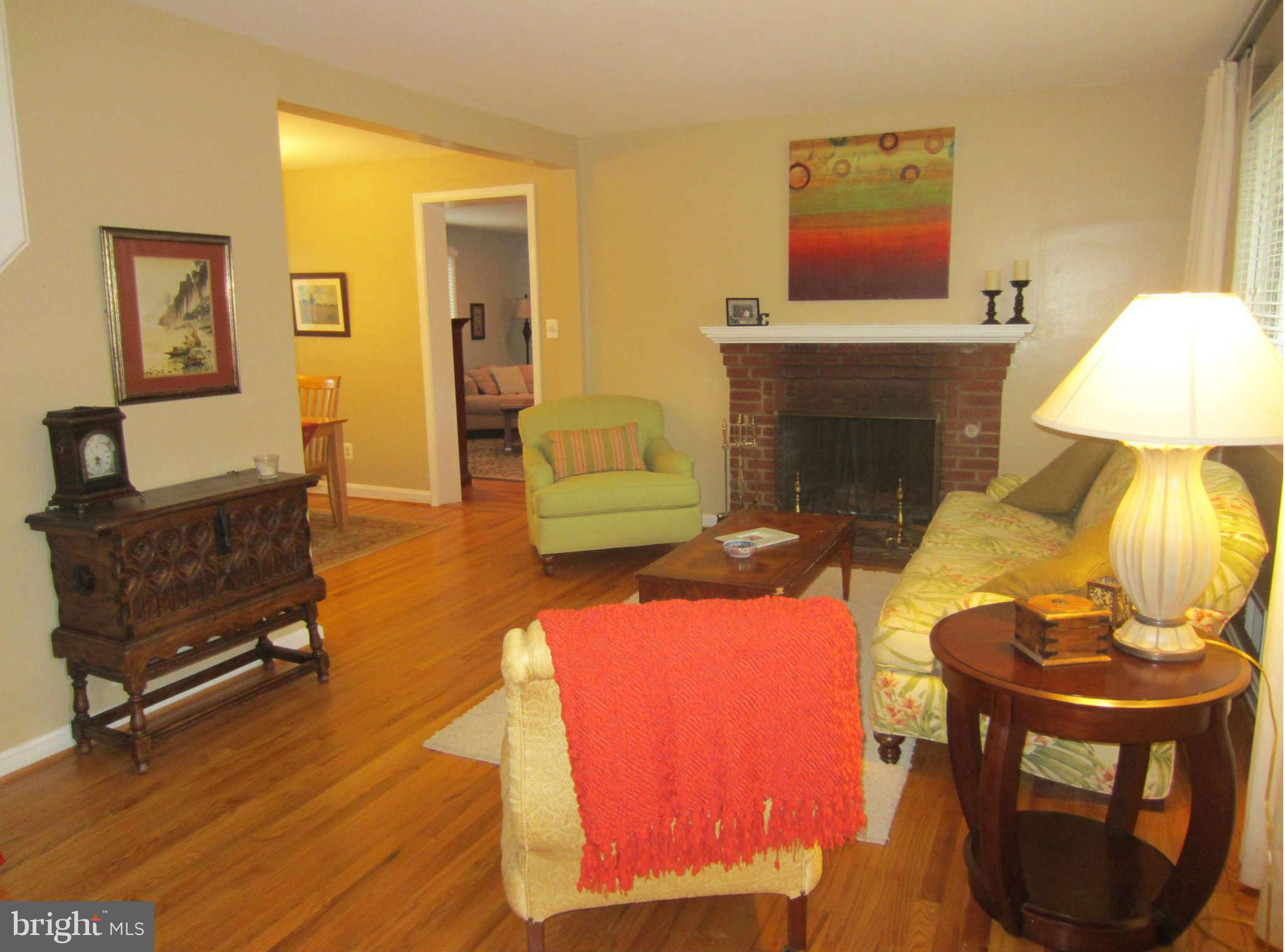 200 Marvin Road Silver Spring, MD 20901 - Photo 2 of 6 a living room with furniture and a fireplace