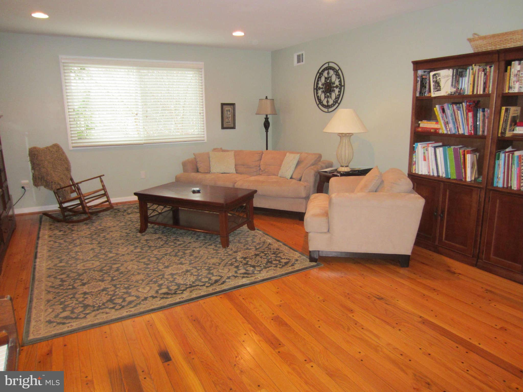 200 Marvin Road Silver Spring, MD 20901 - Photo 3 of 6 a living room with furniture and a book shelf