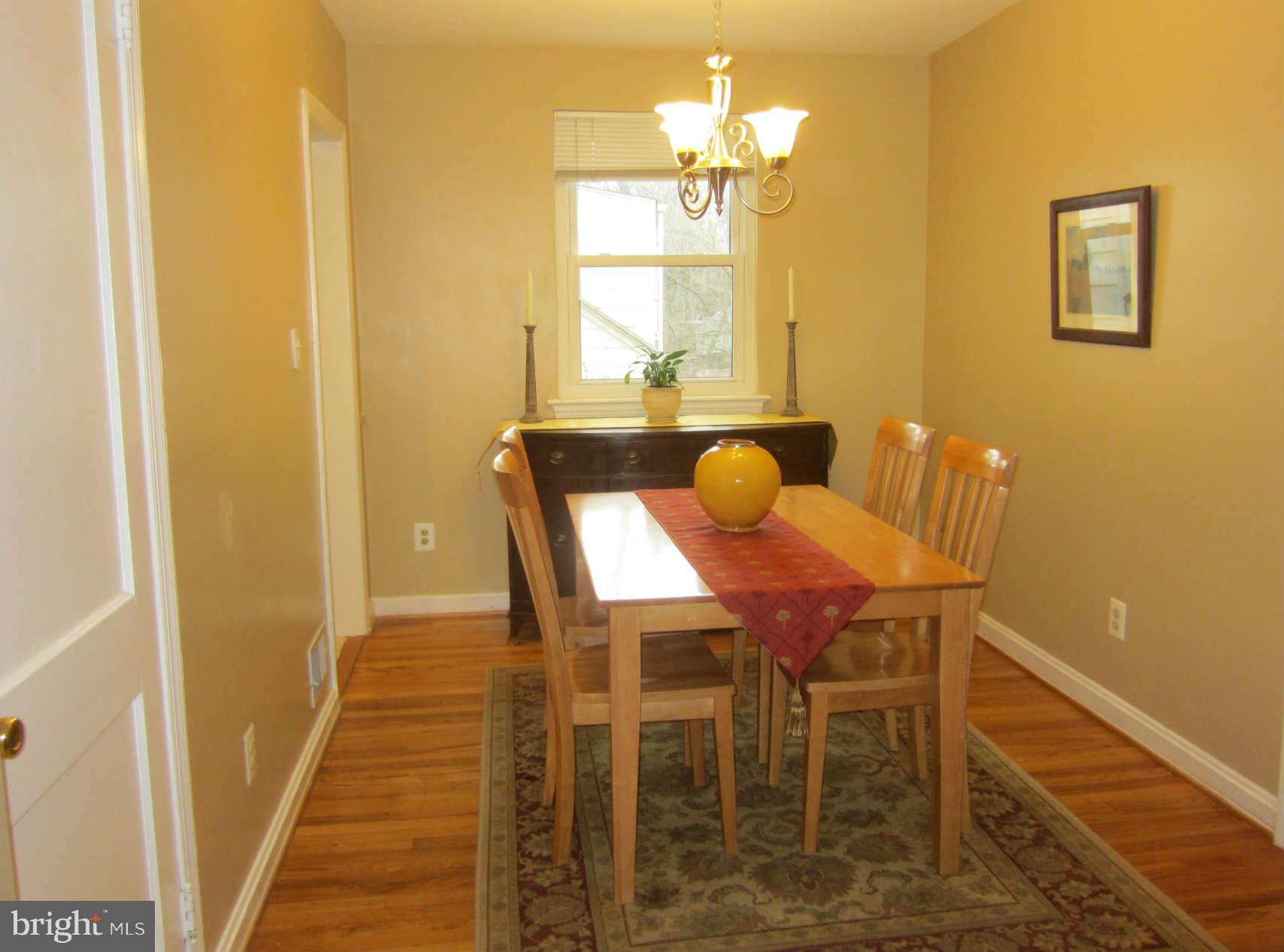 200 Marvin Road Silver Spring, MD 20901 - Photo 5 of 6 a view of a dining room with furniture and wooden floor