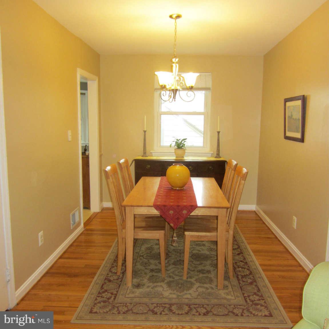 200 Marvin Road Silver Spring, MD 20901 - Photo 6 of 6 a view of a dining room with furniture and wooden floor