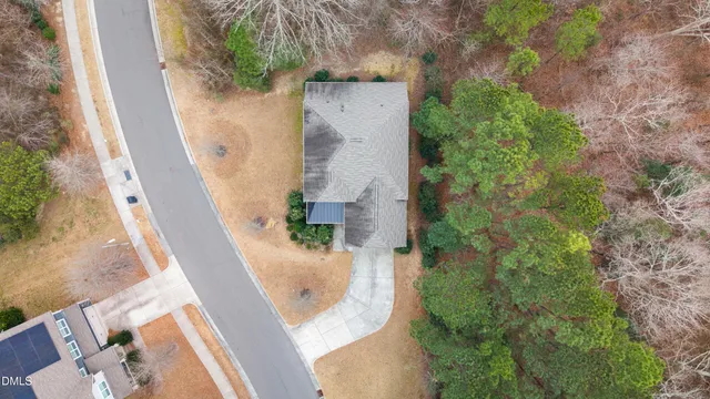 an aerial view of a house with outdoor space