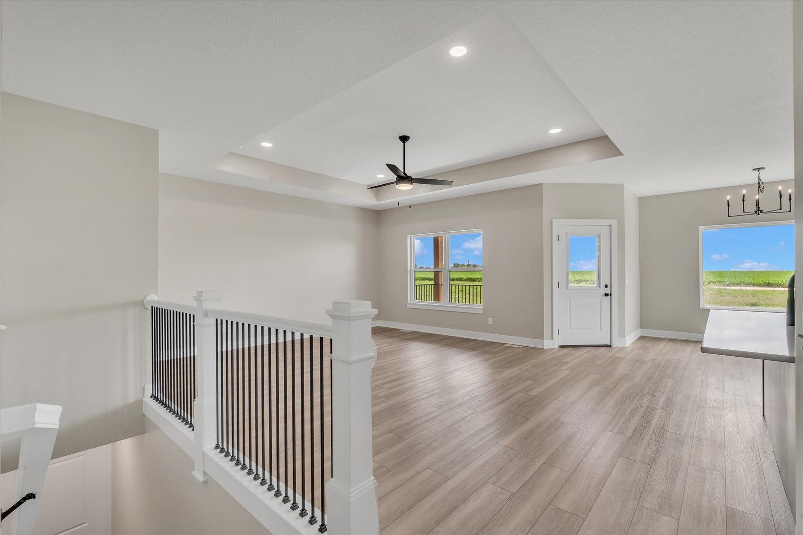 455 Rhonda Road New Liberty, IA 52765 - Photo 12 of 54 wooden floor in an empty room with a window