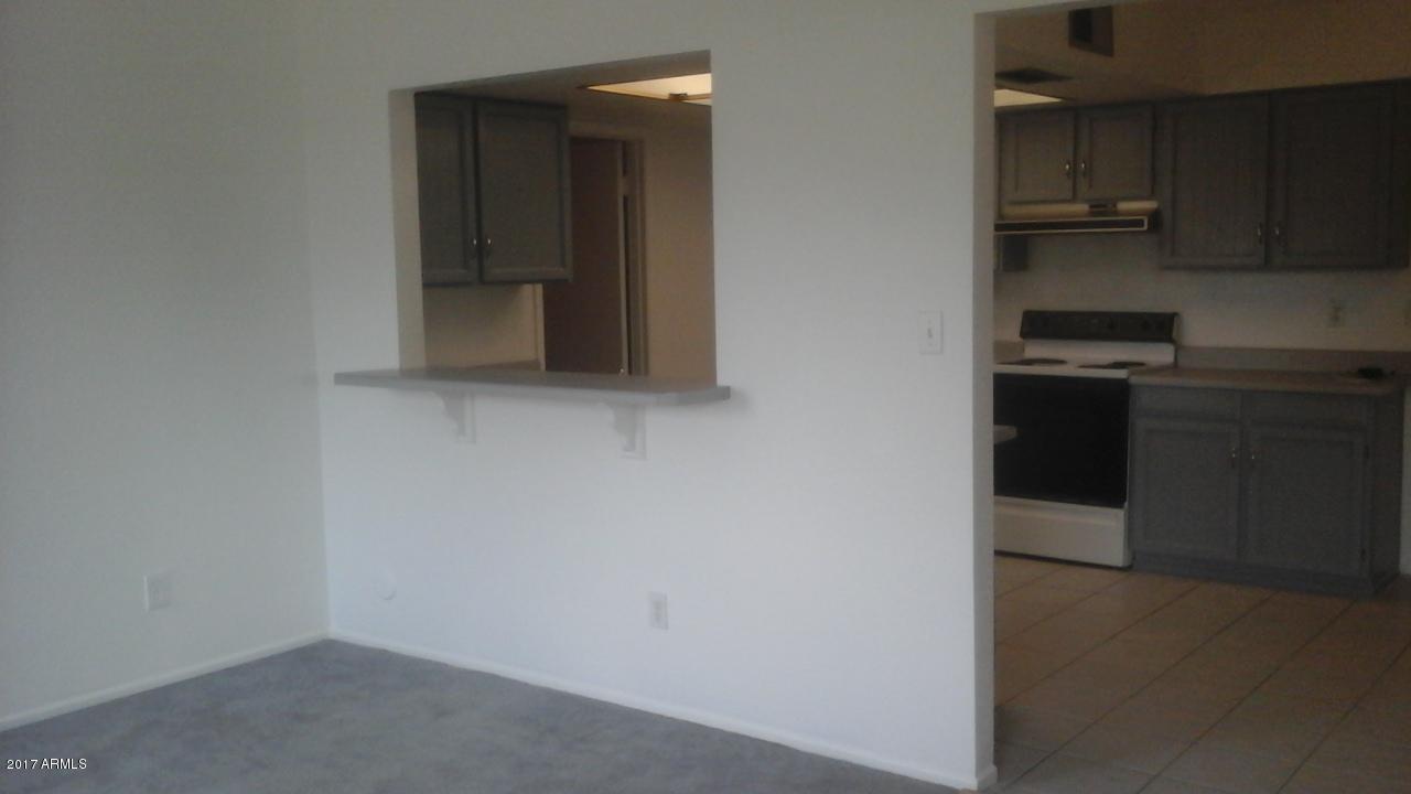 907 West Utopia Road Phoenix, AZ 85027 - Photo 5 of 18 Family room with pass