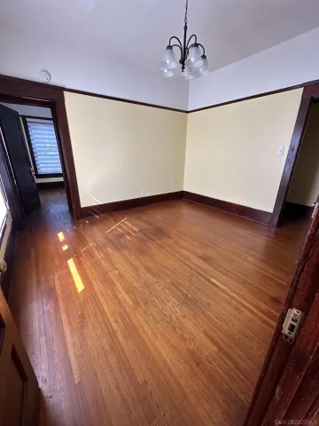 a view of an empty room with a window