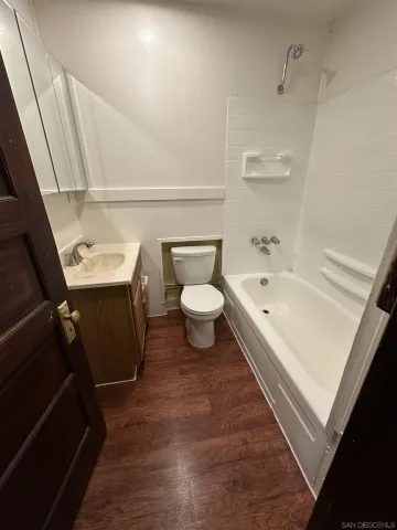 a bathroom with a sink a toilet and bathtub