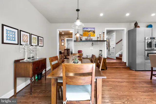 a view of kitchen dining table and chairs