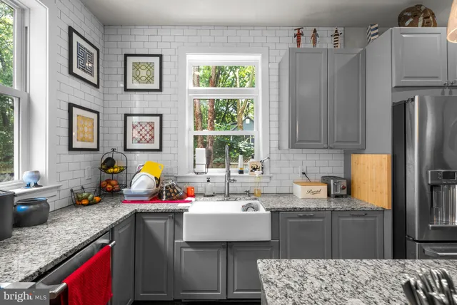 a kitchen with a sink stove and refrigerator