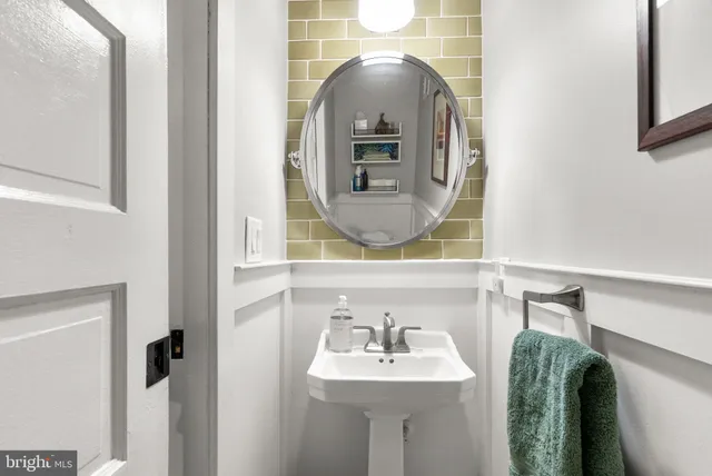 a bathroom with a sink and mirror
