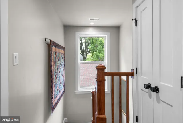 a view of a porch with wooden floor and stairs