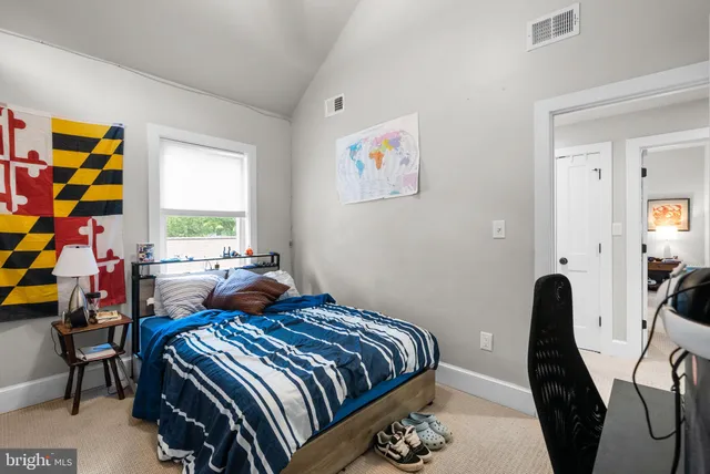 a bedroom with a bed and furniture