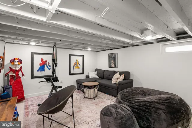 a bedroom with furniture and a gym