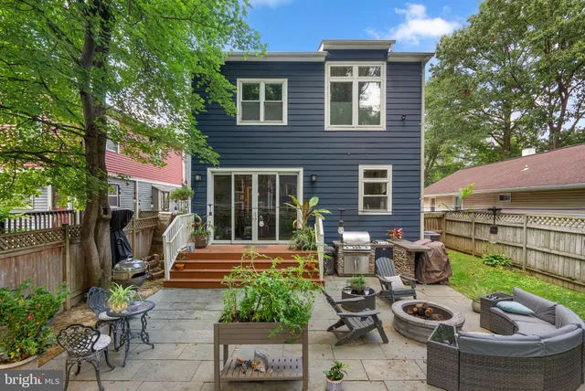 a view of a patio with table and chairs and potted plants
