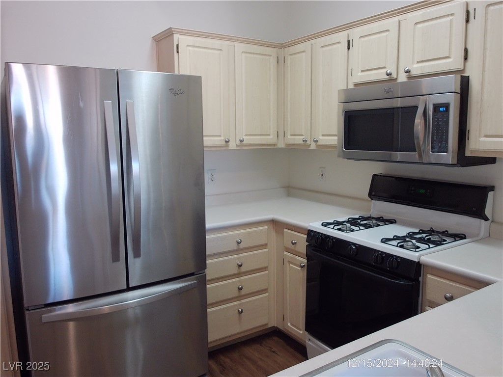 855 North Stephanie Street, Unit 2526 Henderson, NV 89014 - Photo 11 of 26 Kitchen featuring appliances with stainless steel finishes, light countertops, and dark wood-style flooring