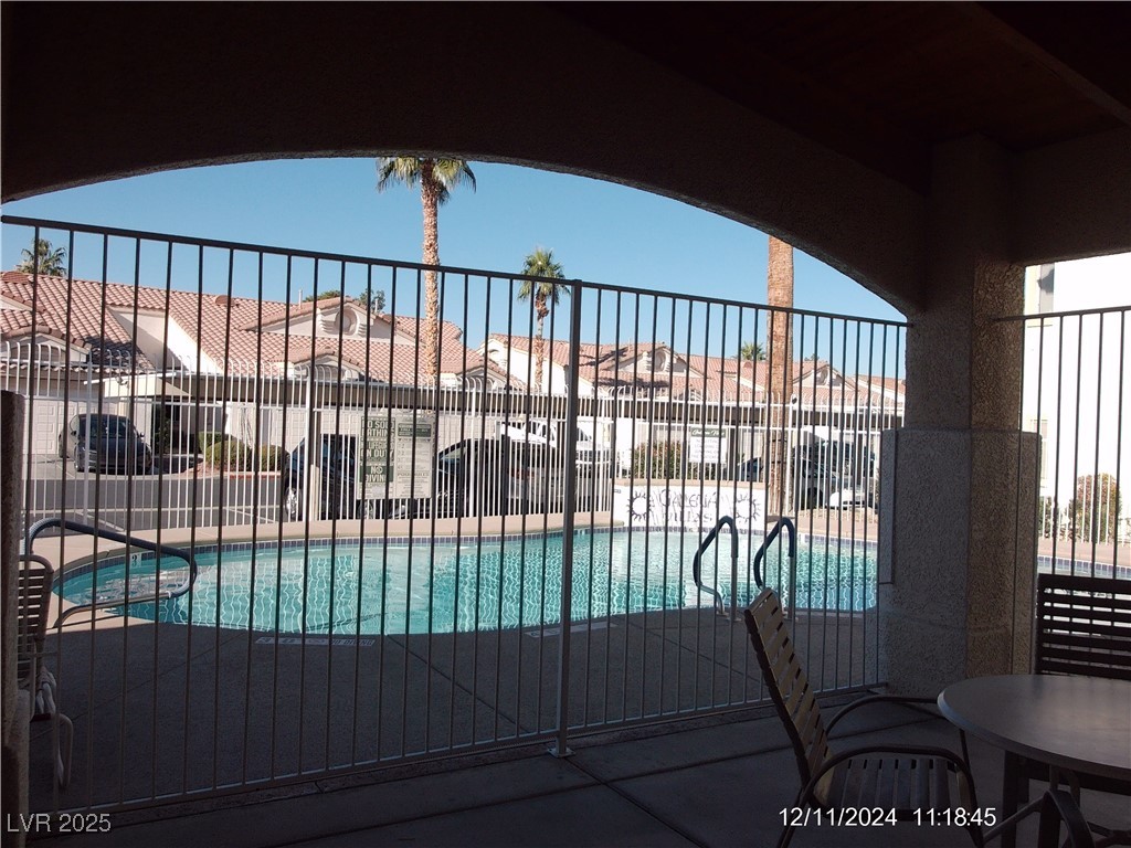 855 North Stephanie Street, Unit 2526 Henderson, NV 89014 - Photo 23 of 26 Community pool featuring a patio area and a residential view