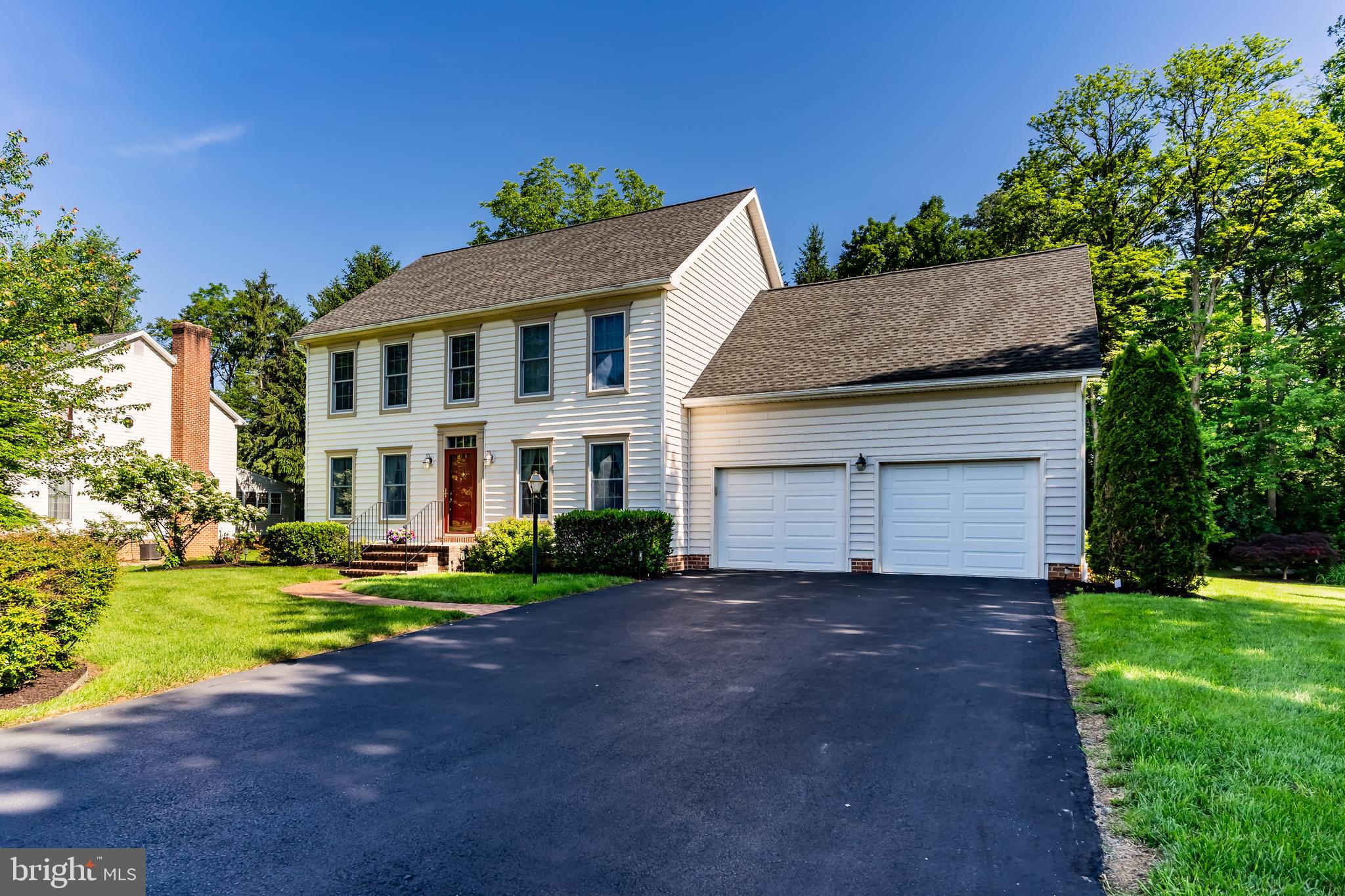 13 Todd Road Carlisle, PA 17013 - Photo 2 of 46 a view of a white house with a yard and potted plants