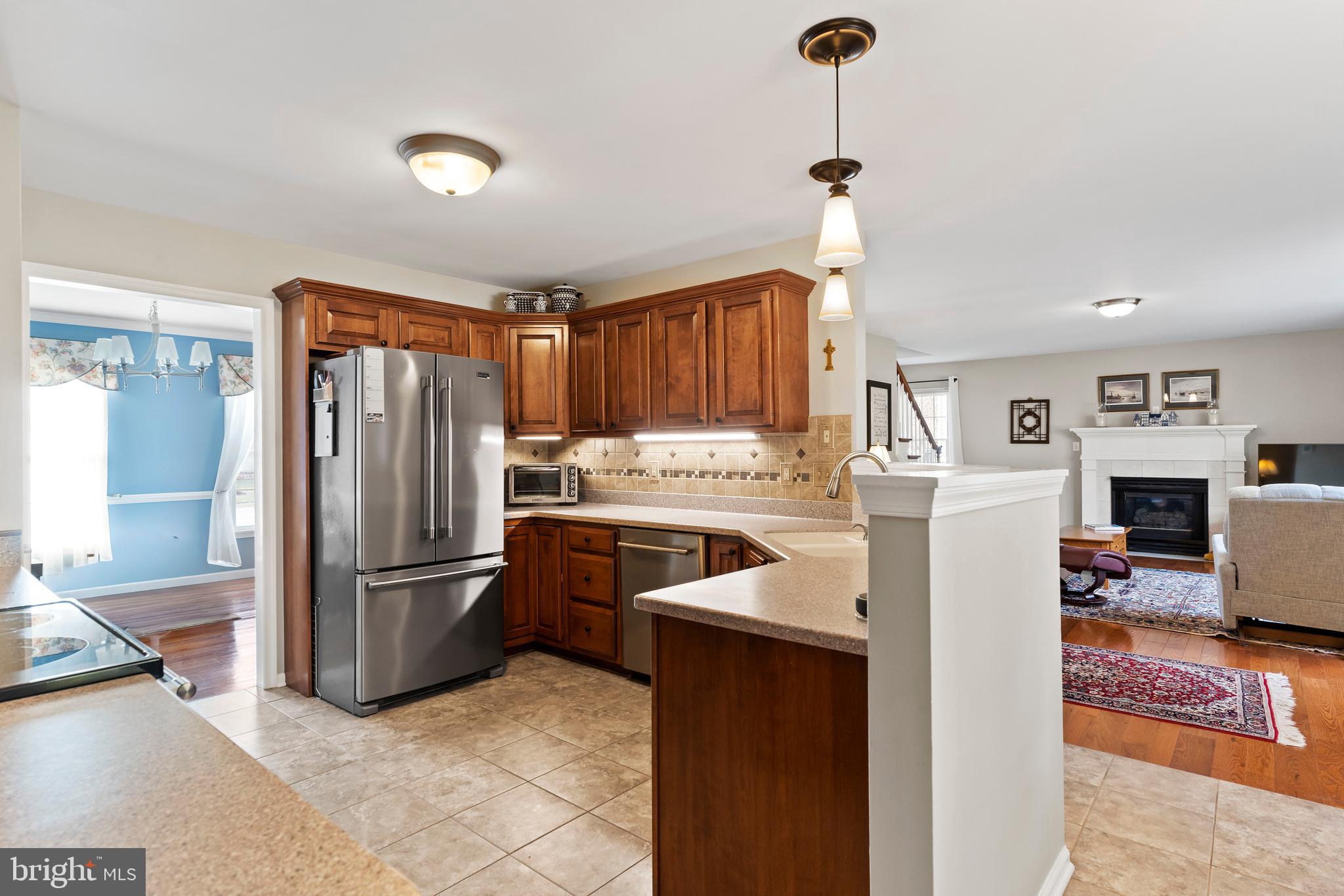 13 Todd Road Carlisle, PA 17013 - Photo 22 of 46 a kitchen with stainless steel appliances granite countertop a refrigerator and a stove top oven
