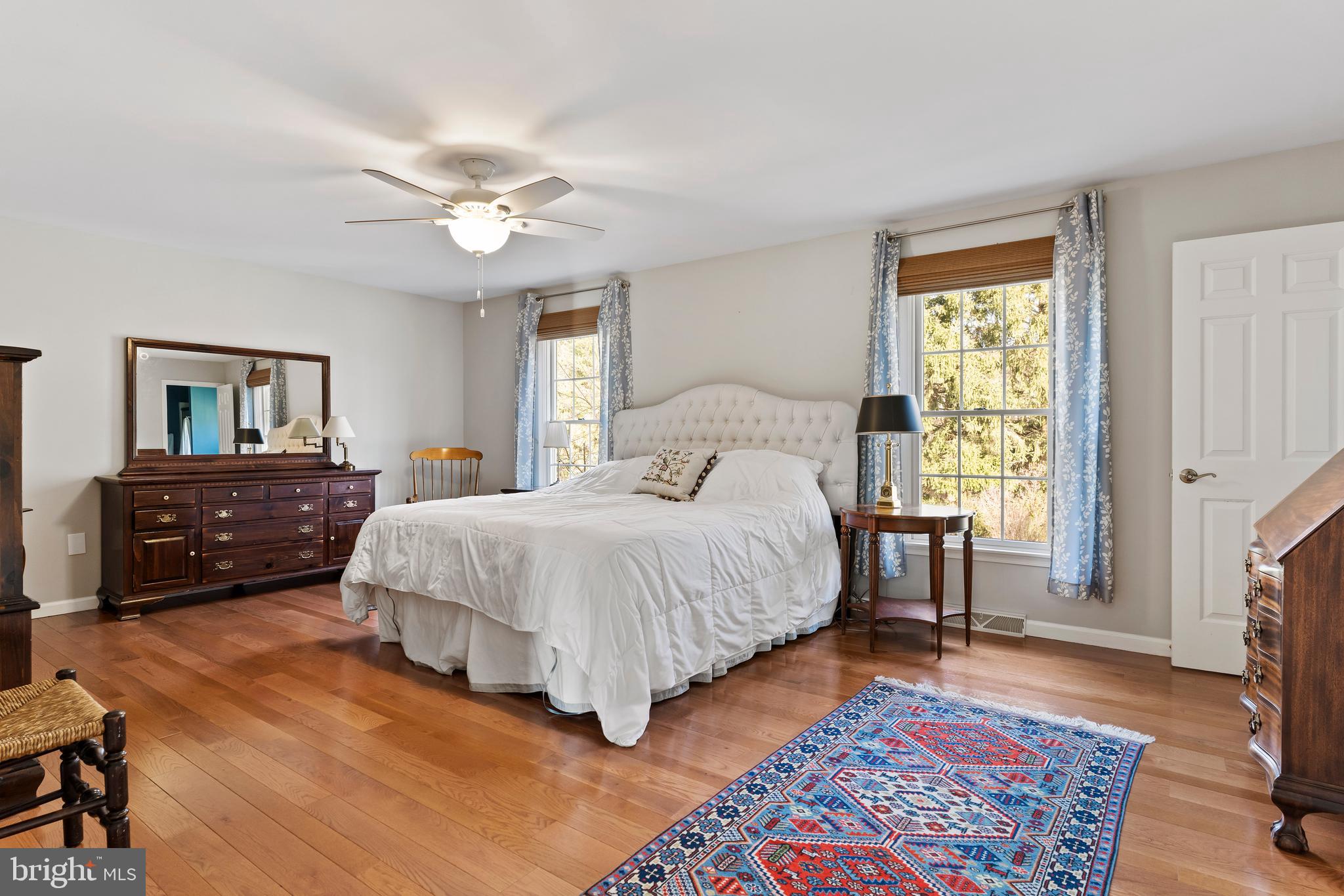 13 Todd Road Carlisle, PA 17013 - Photo 35 of 46 a spacious bedroom with a bed a table and a chandelier