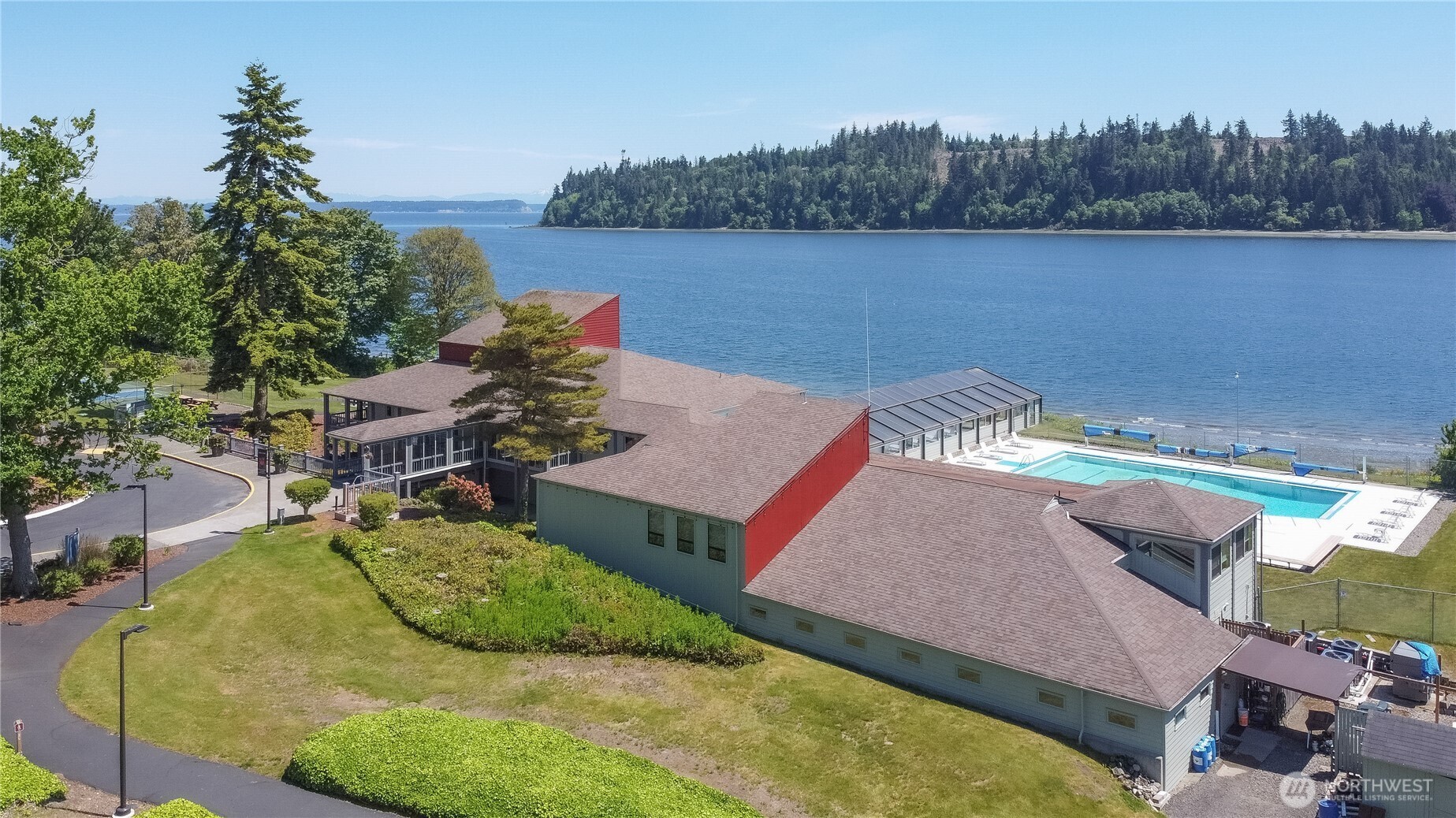 91 Drew Lane Port Ludlow, WA 98365 - Photo 21 of 38 an aerial view of a house with swimming pool and a yard