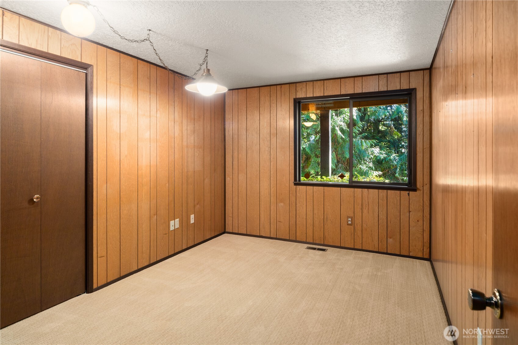 91 Drew Lane Port Ludlow, WA 98365 - Photo 26 of 38 a view of an empty room with a window