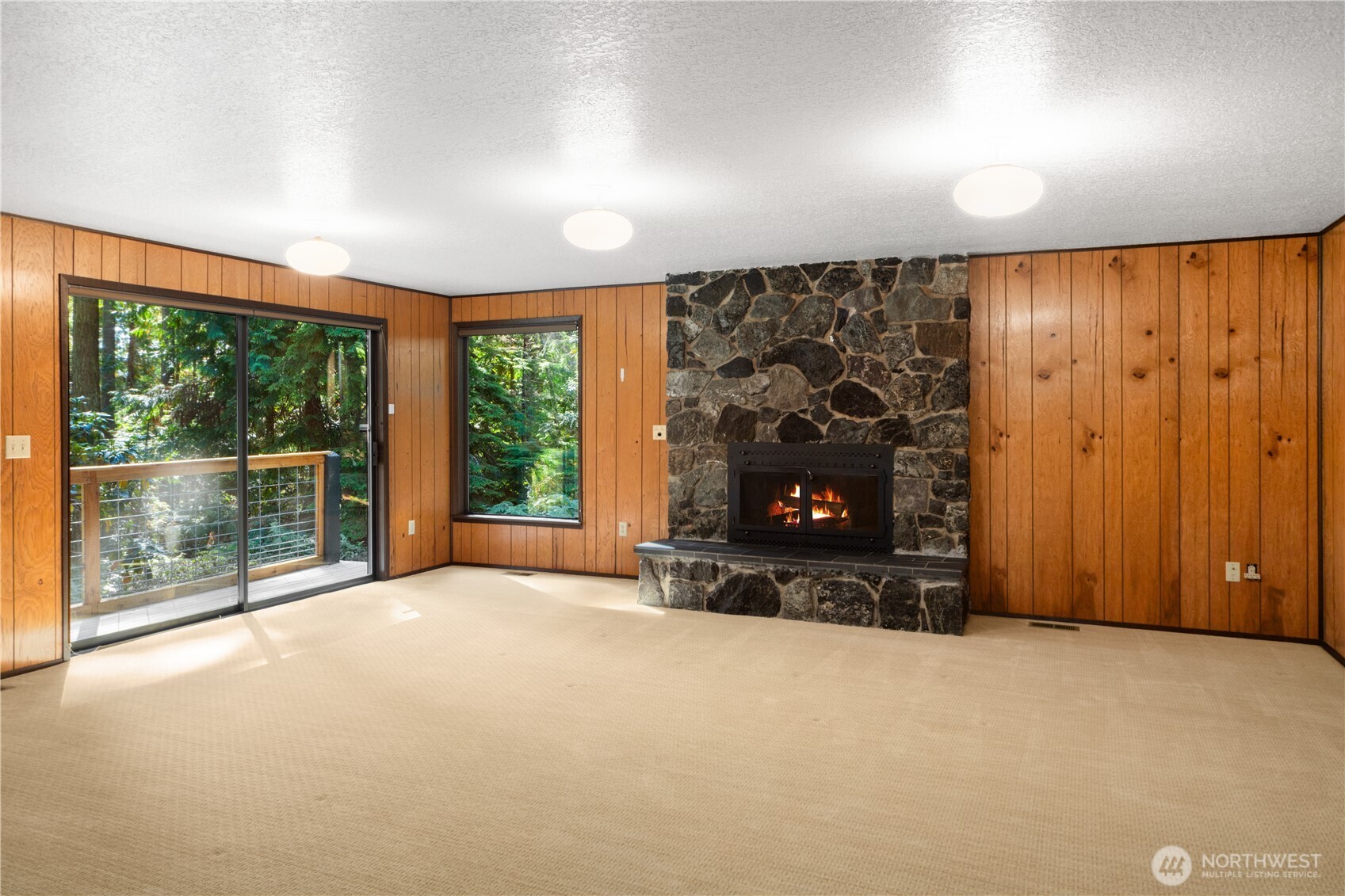 91 Drew Lane Port Ludlow, WA 98365 - Photo 27 of 38 an empty room with furniture fire place and a fireplace
