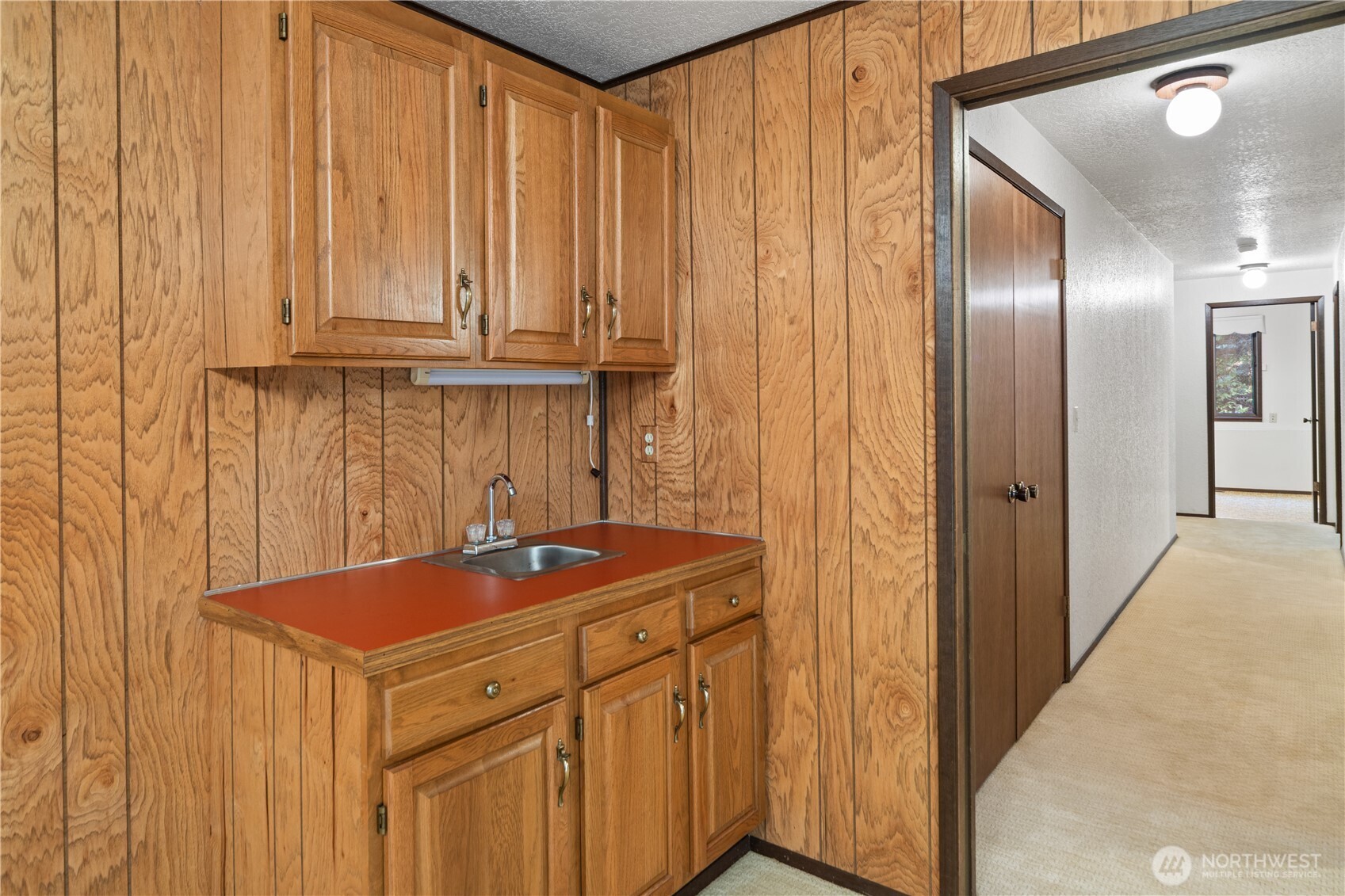 91 Drew Lane Port Ludlow, WA 98365 - Photo 30 of 38 a kitchen with a sink and cabinets
