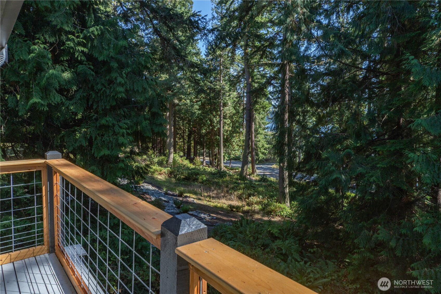 91 Drew Lane Port Ludlow, WA 98365 - Photo 34 of 38 a view of a wooden deck and trees