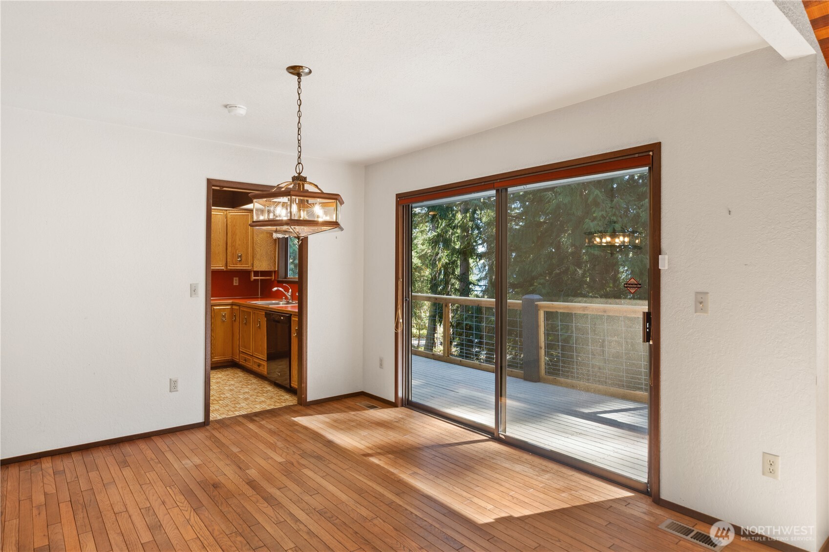 91 Drew Lane Port Ludlow, WA 98365 - Photo 9 of 38 a view of a room with wooden floor and windows