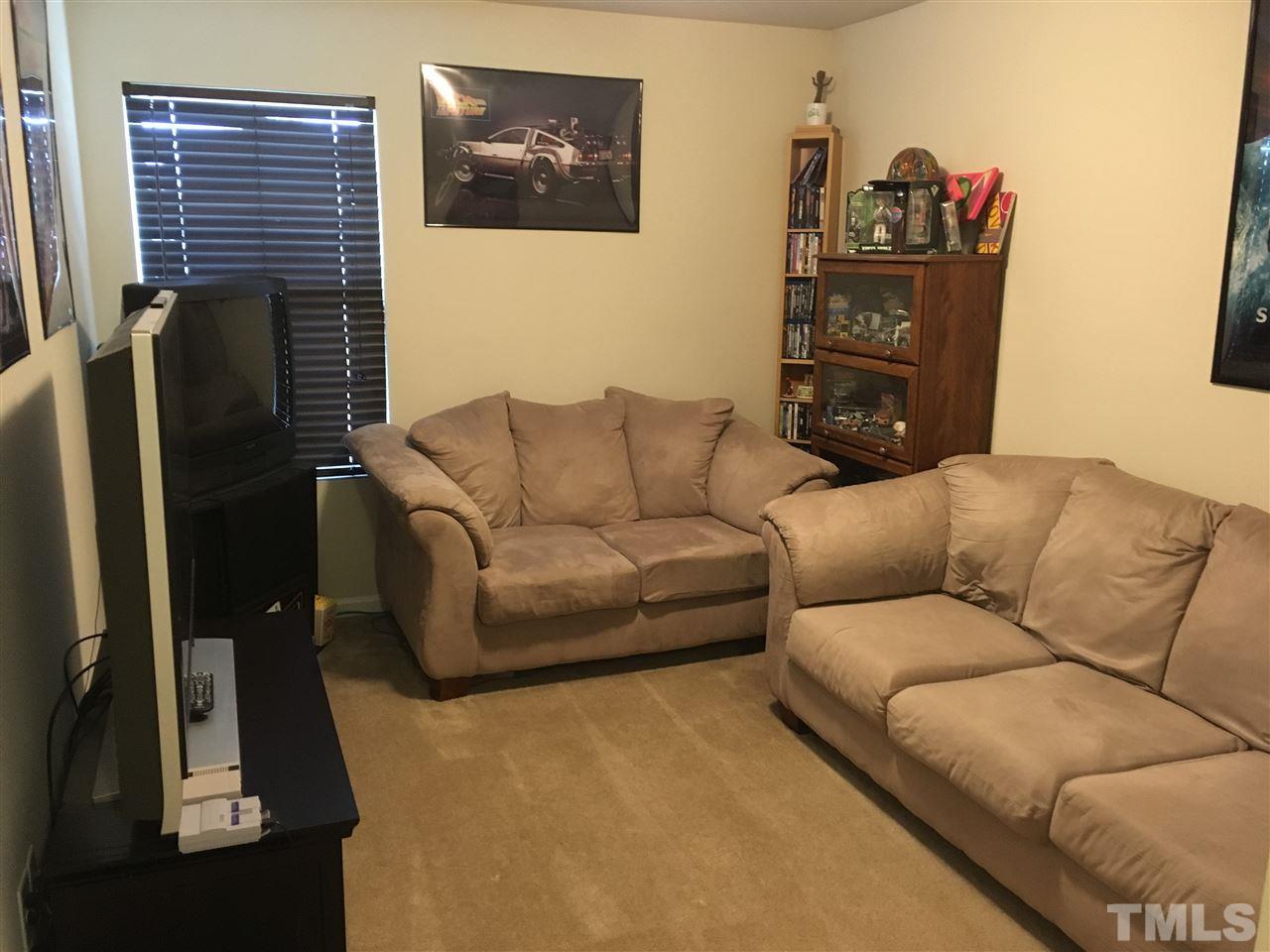 641 Hastings Road Mebane, NC 27302 - Photo 13 of 23 a living room with furniture and a flat screen tv