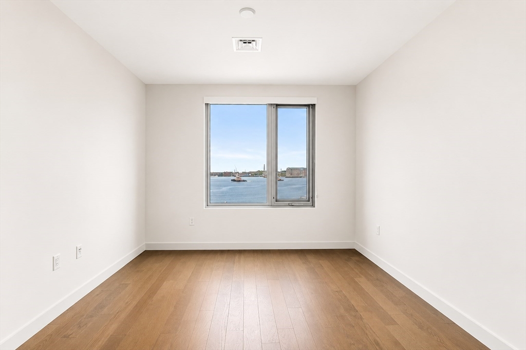 45 Lewis Street, Unit 312 Boston, MA 02128 - Photo 6 of 17 an empty room with a window
